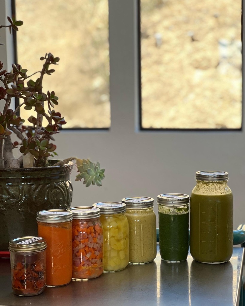 Photo of 7 mason jars filled with foods of different colors